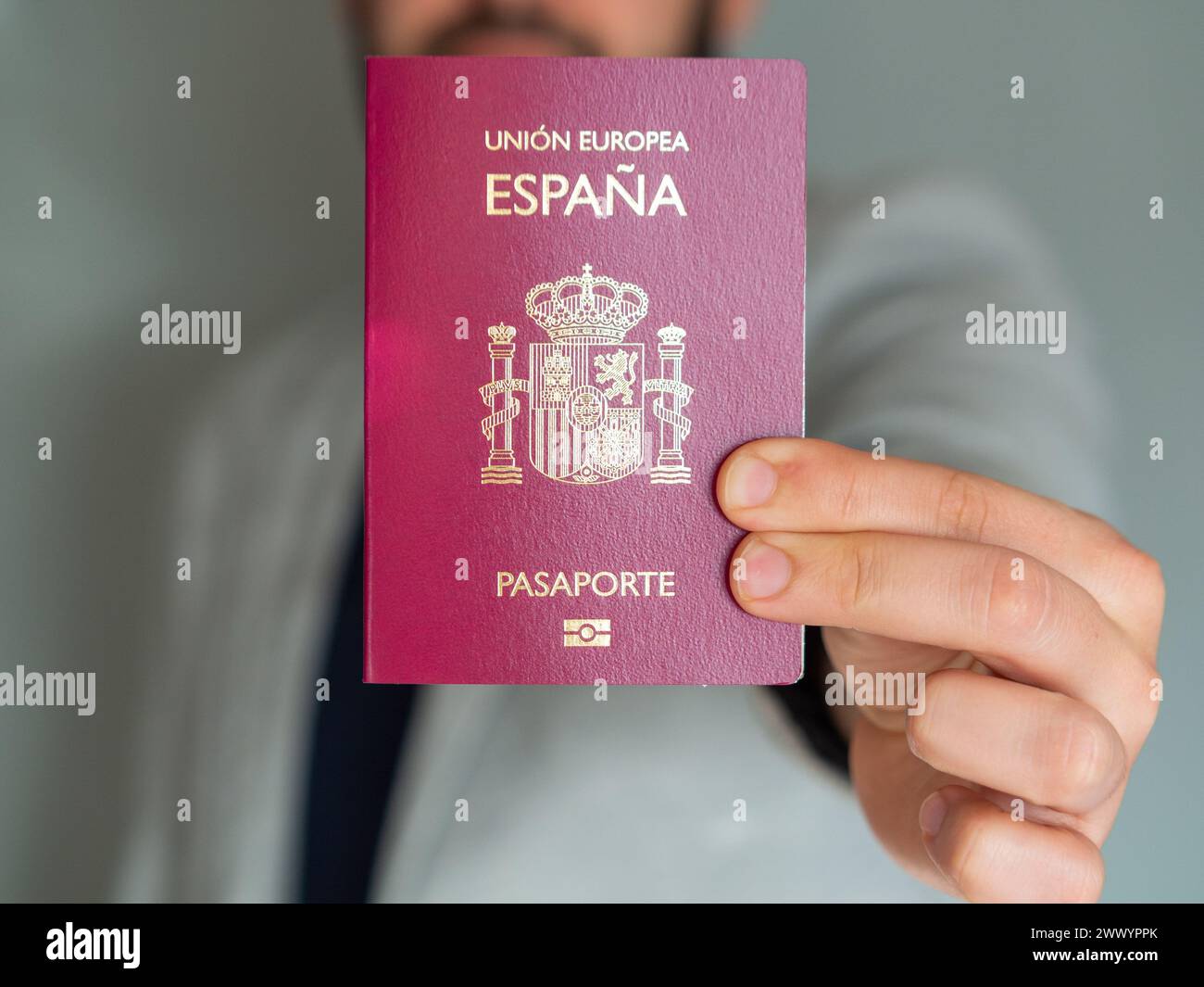 Businessman holding his spanish european union passport Stock Photo