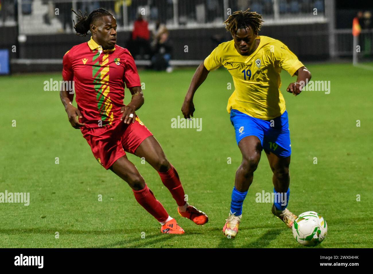 CHAMBLY, FRANCE - MARCH 25; Jacques Ekomie of Gabon and Gaus Makouta of ...