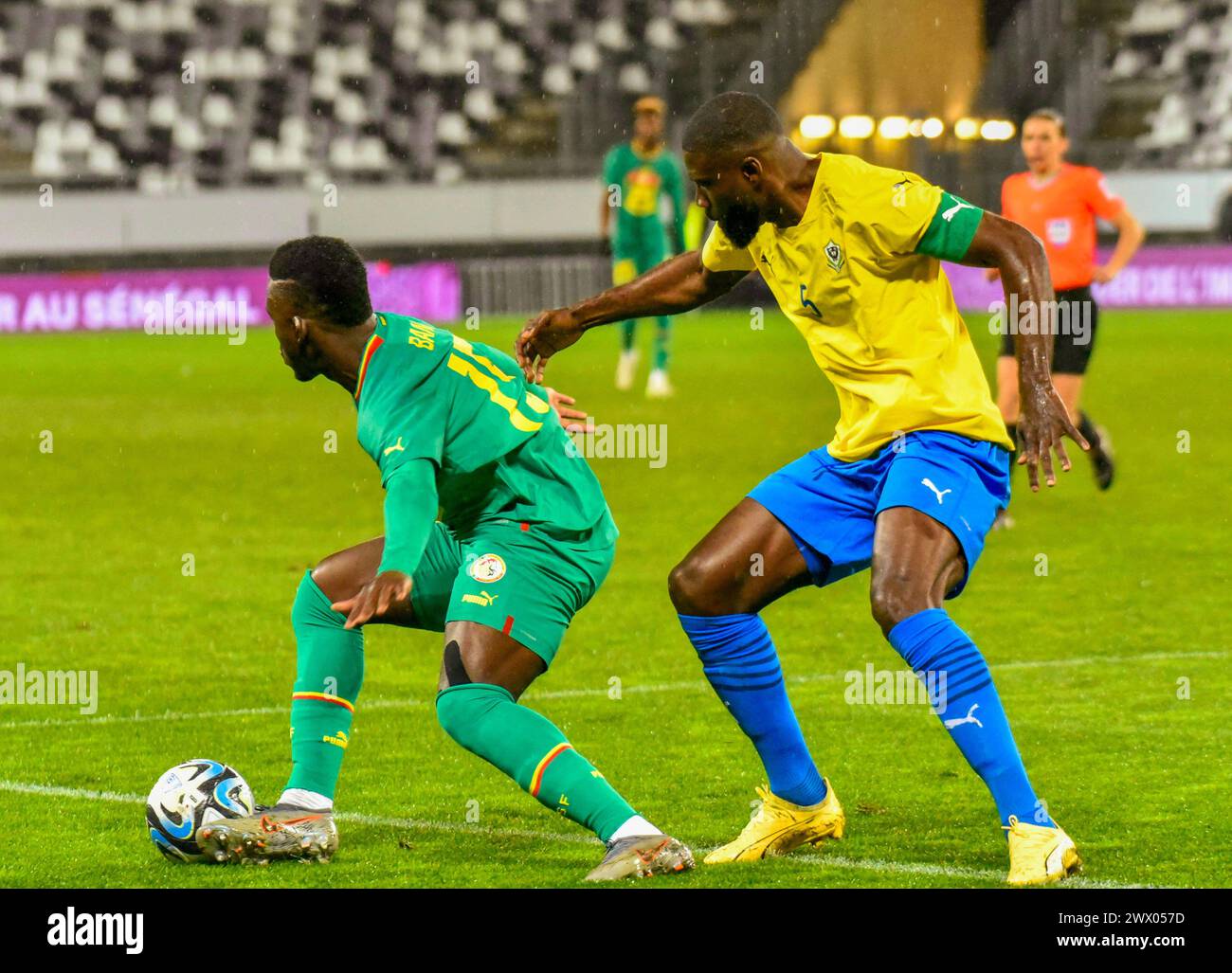 AMIENS, FRANCE - MARCH 22;   Dieng Bamba of Senegal and Ecuele Manga Bruno of Gabon during the FIFA International Friendly match between Senegal and G Stock Photo