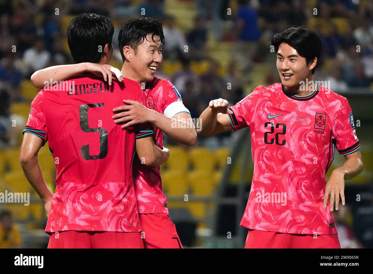 Bangkok, Thailand. 26th Mar, 2024. Son Heung-min (C) of South Korea celebrates with Park Jin-seob #5 and Seol Young-woo #22 after a goal during the FIFA World Cup 2026 Qualifiers Group C match between Thailand and South Korea at Rajamangala National stadium in Bangkok. Final score; Thailand 0 : 3 South Korea. Credit: SOPA Images Limited/Alamy Live News Stock Photo