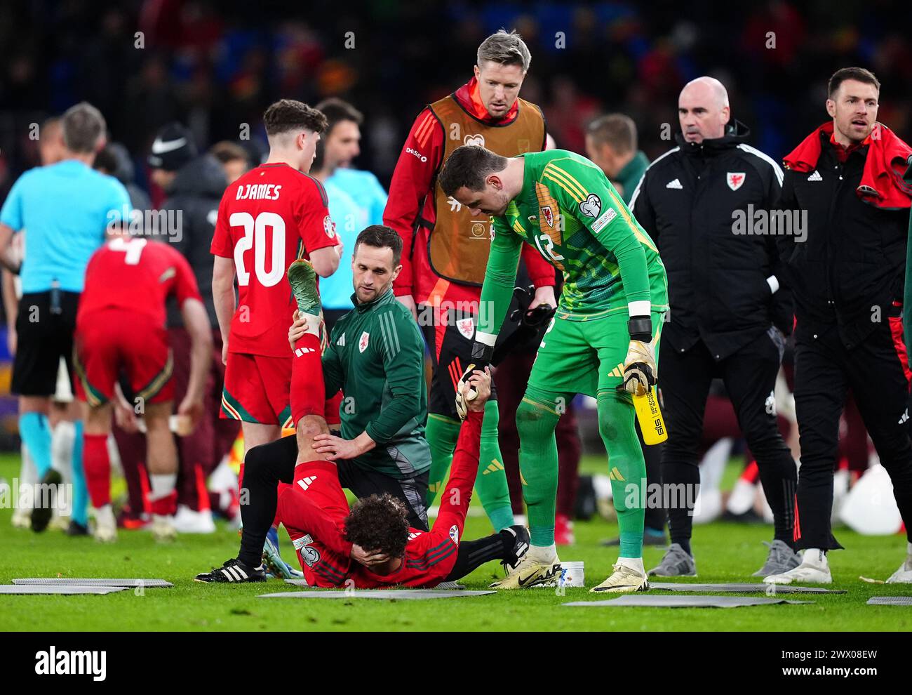 Wales' Ethan Ampadu stretches his leg as the game goes to extra time during the UEFA Euro 2024 Qualifying play-off final at the Cardiff City Stadium, Wales. Picture date: Tuesday March 26, 2024. Stock Photo