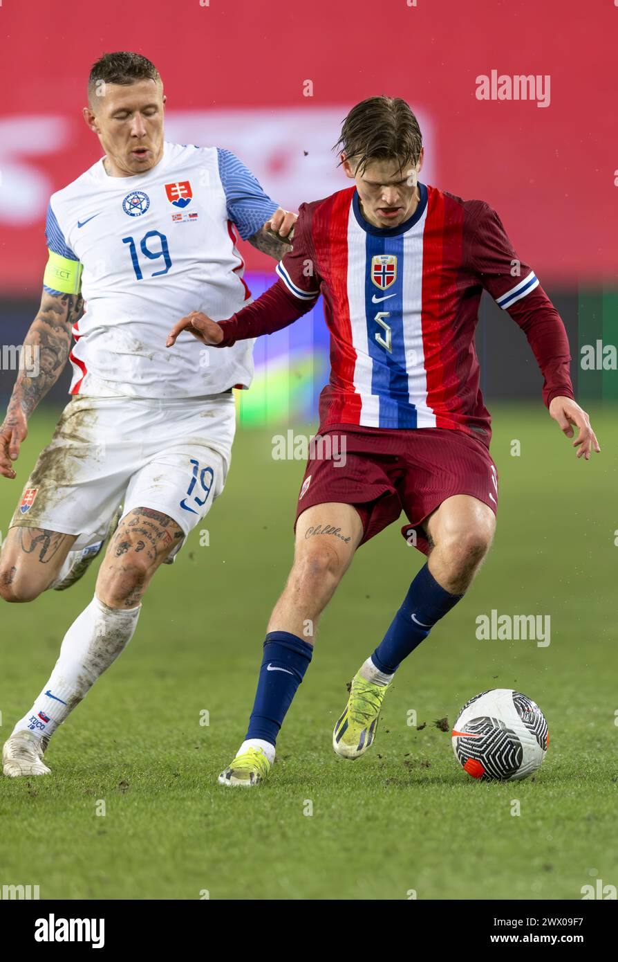 Oslo, Norway 26 March 2024,  David Moller Wolfe of Norway and AZ Alkmaar manoeuvres the ball during the football friendly match between Norway and the Slovakia held at the Ullevaal Stadium in Oslo, Norway Credit: Nigel Waldron/Alamy Live News Stock Photo