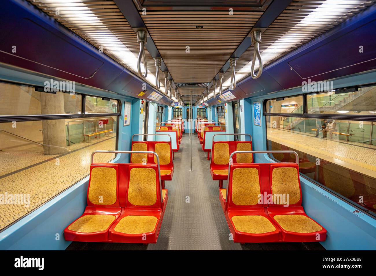 Interior of an empty subway carriage without passengers stopped on an underground station platform. Lisbon, Portugal.03-03-2024 Stock Photo