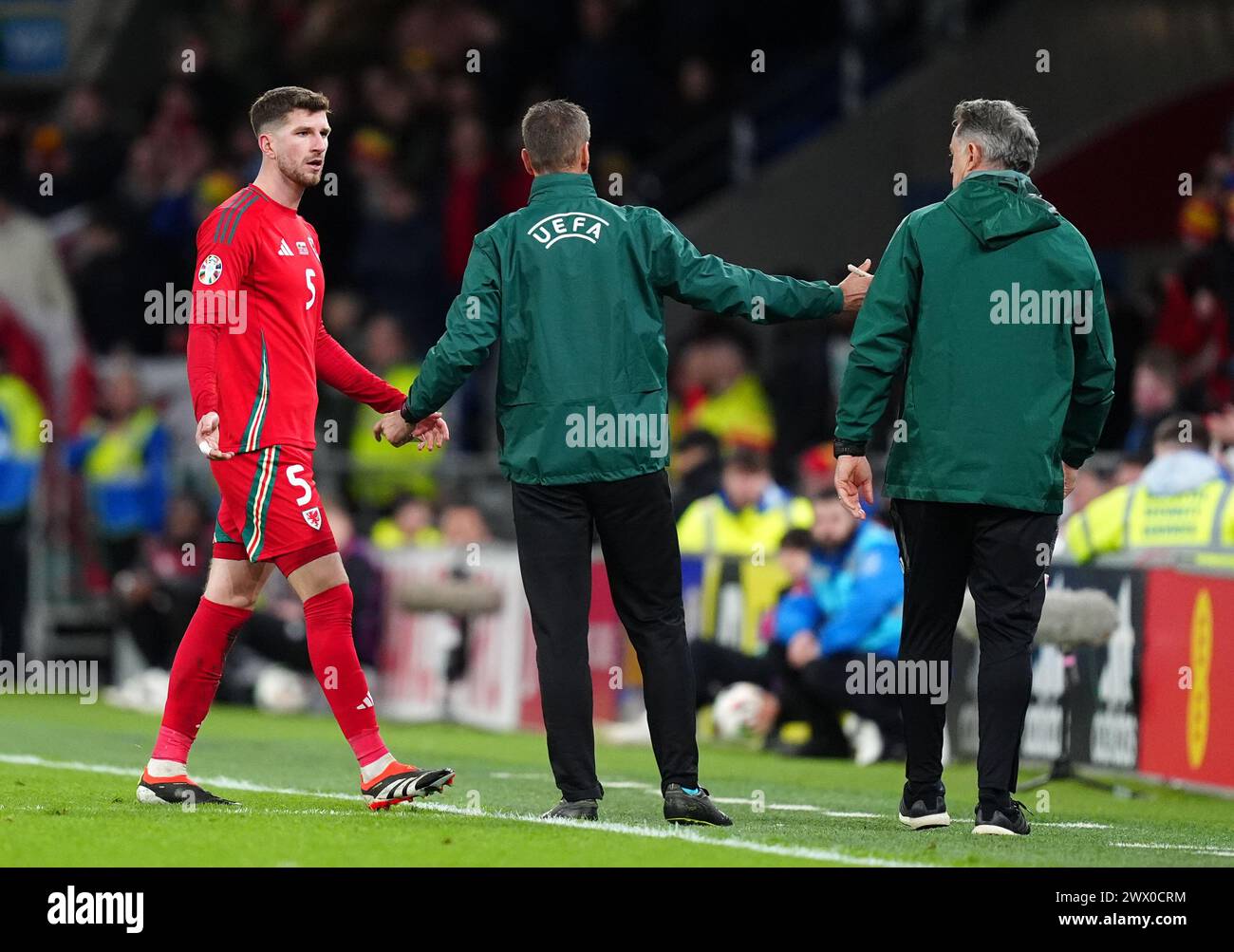 Wales' Chris Mepham leaves the pitch after being shown a red card during the UEFA Euro 2024 Qualifying play-off final at Cardiff City Stadium, Cardiff. Picture date: Tuesday March 26, 2024. Stock Photo