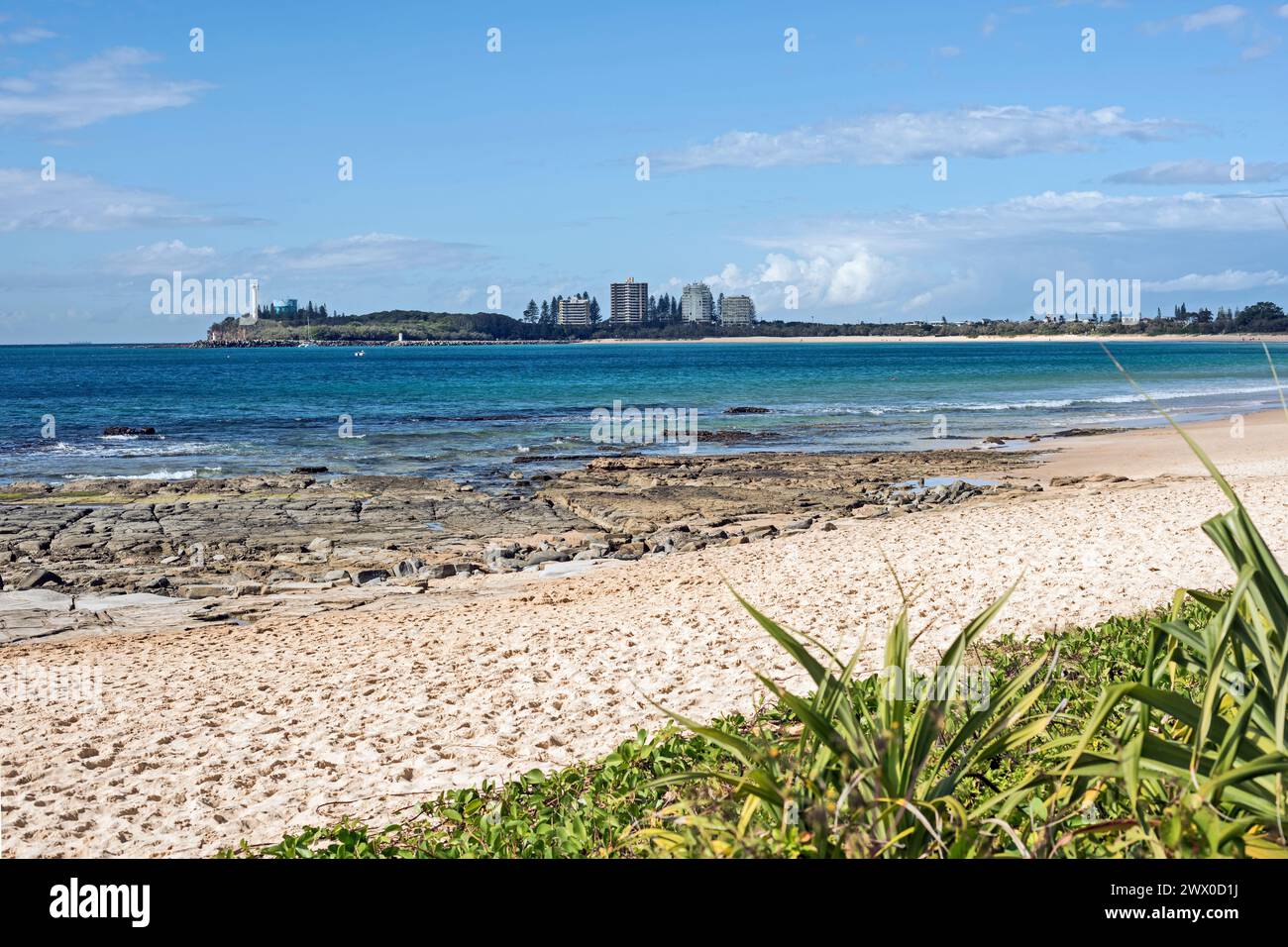 Point Cartwright, with lighthouse and apartments, seen from Alexandra headland Stock Photo