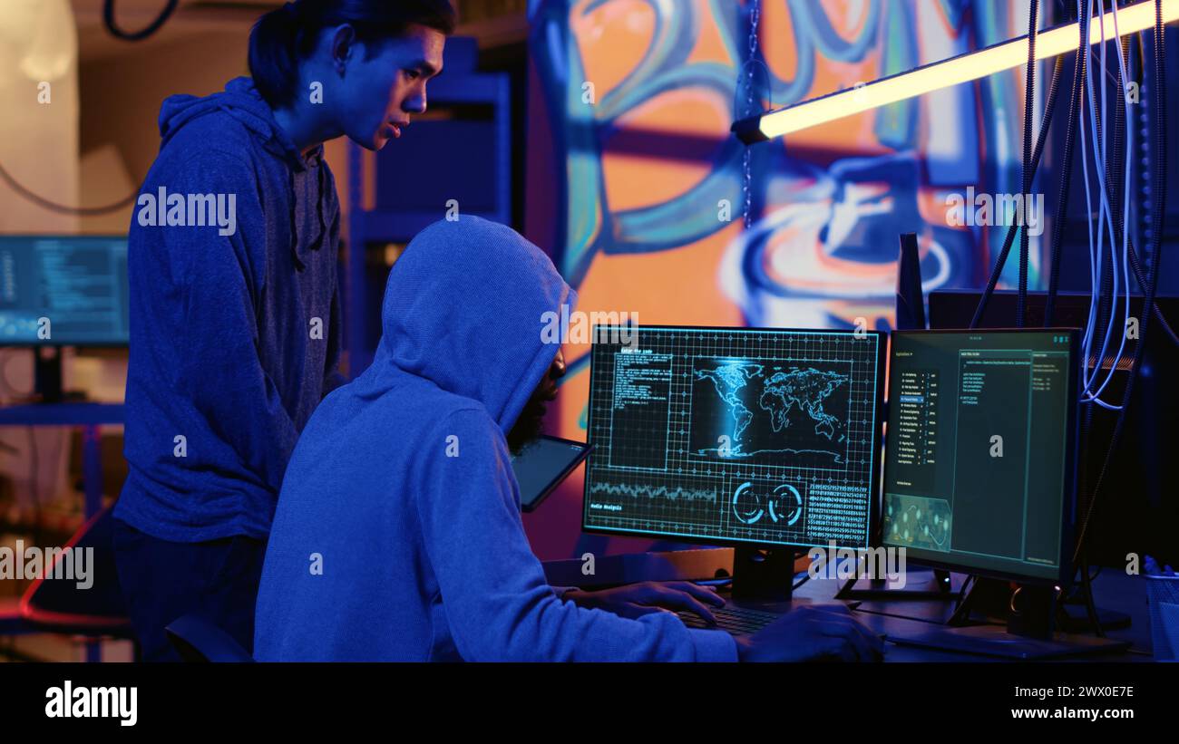 Hackers in dark room trying to steal valuable data by targeting ...