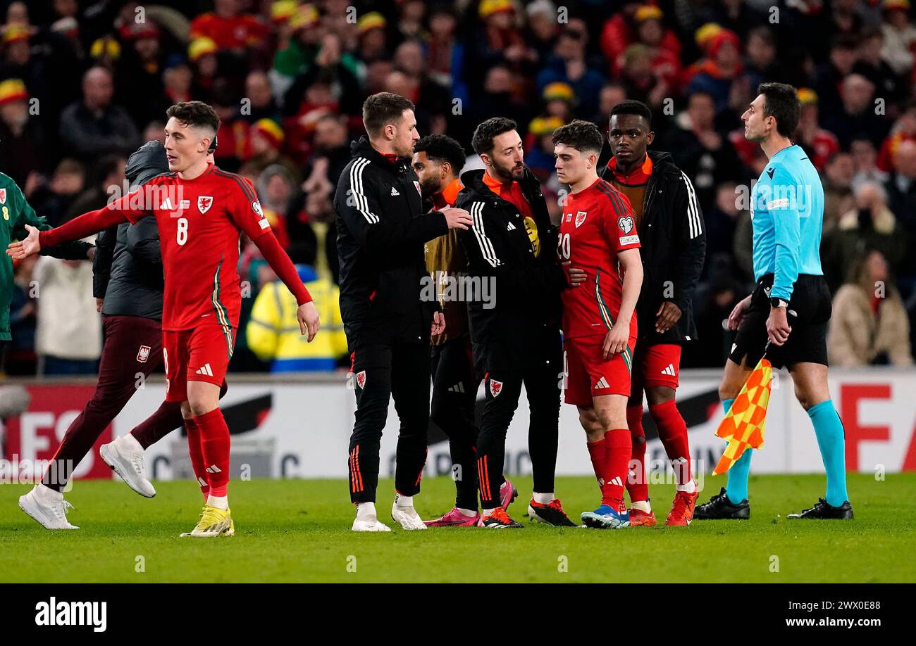 Wales' Daniel James is consoled after missing the decisive penalty in the shoot out during the UEFA Euro 2024 Qualifying play-off final at the Cardiff City Stadium, Wales. Picture date: Tuesday March 26, 2024. Stock Photo