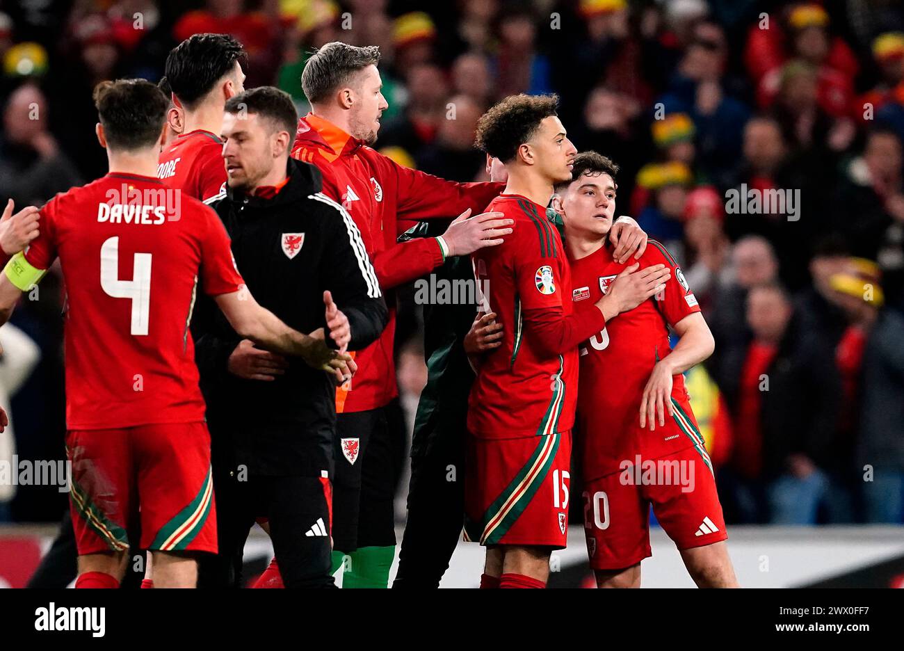 Wales' Daniel James is consoled after missing the decisive penalty in the shoot out during the UEFA Euro 2024 Qualifying play-off final at the Cardiff City Stadium, Wales. Picture date: Tuesday March 26, 2024. Stock Photo