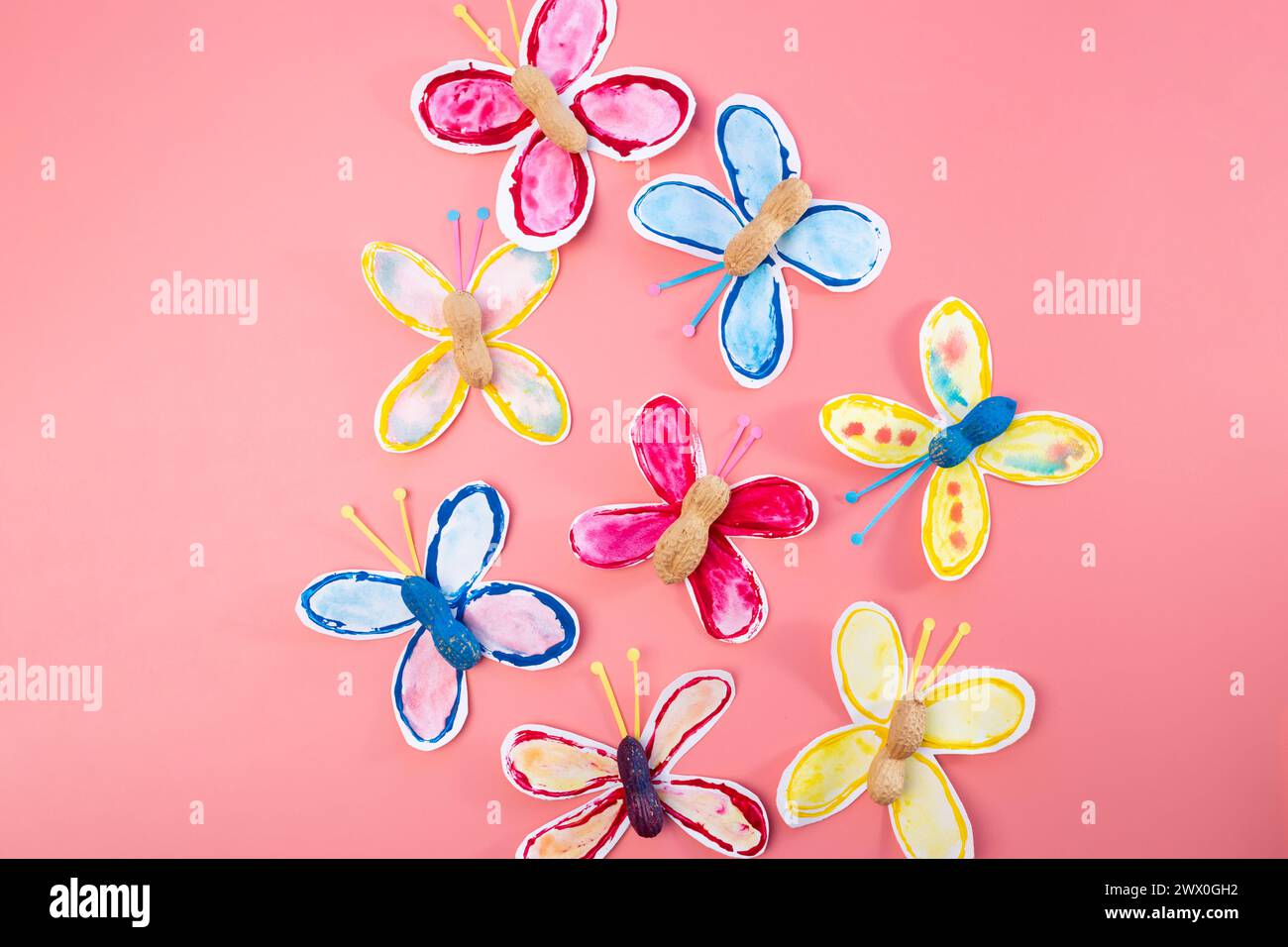 making paper craft butterflies, stamp, paint tubes, recycling concept ...