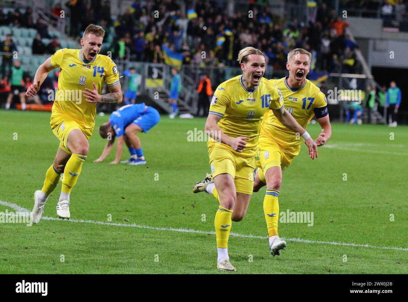 Wroclaw, Poland - March 26, 2024: Mykhailo Mudryk of Ukraine (C) celebrates after scored a goal during the UEFA EURO 2024 Play-off game against Iceland at Tarczynski Arena in Wroclaw. Ukraine won 2-1 Stock Photo