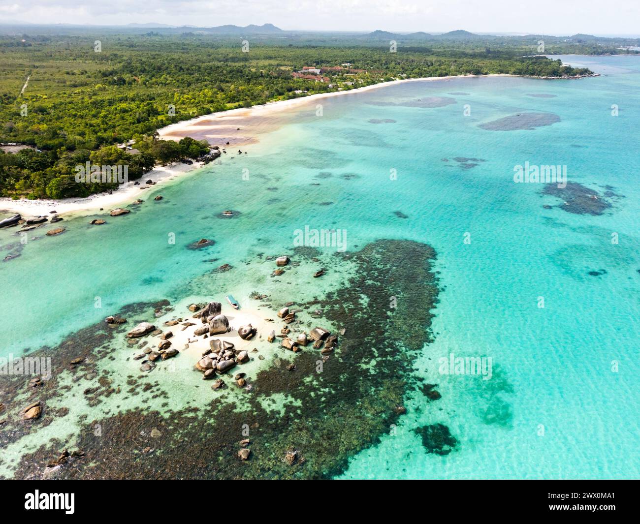 Belitung beach and islands drone view. Beautiful aerial view of islands, boat, sea and rocks in Belitung, Indonesia  Stock Photo