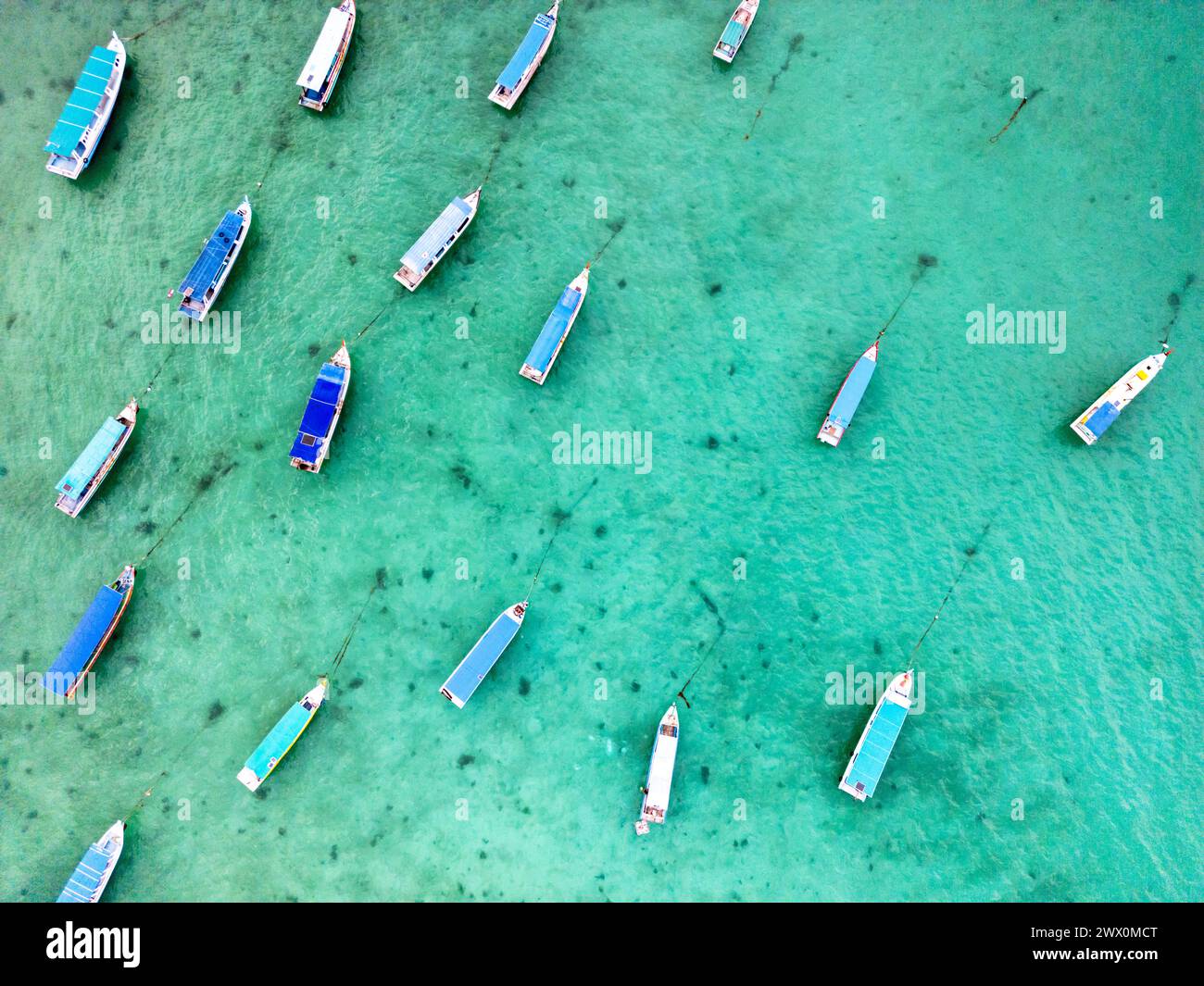 tourist boats on tropical sea in Belitung, Indonesia, drone aerial top down view Stock Photo