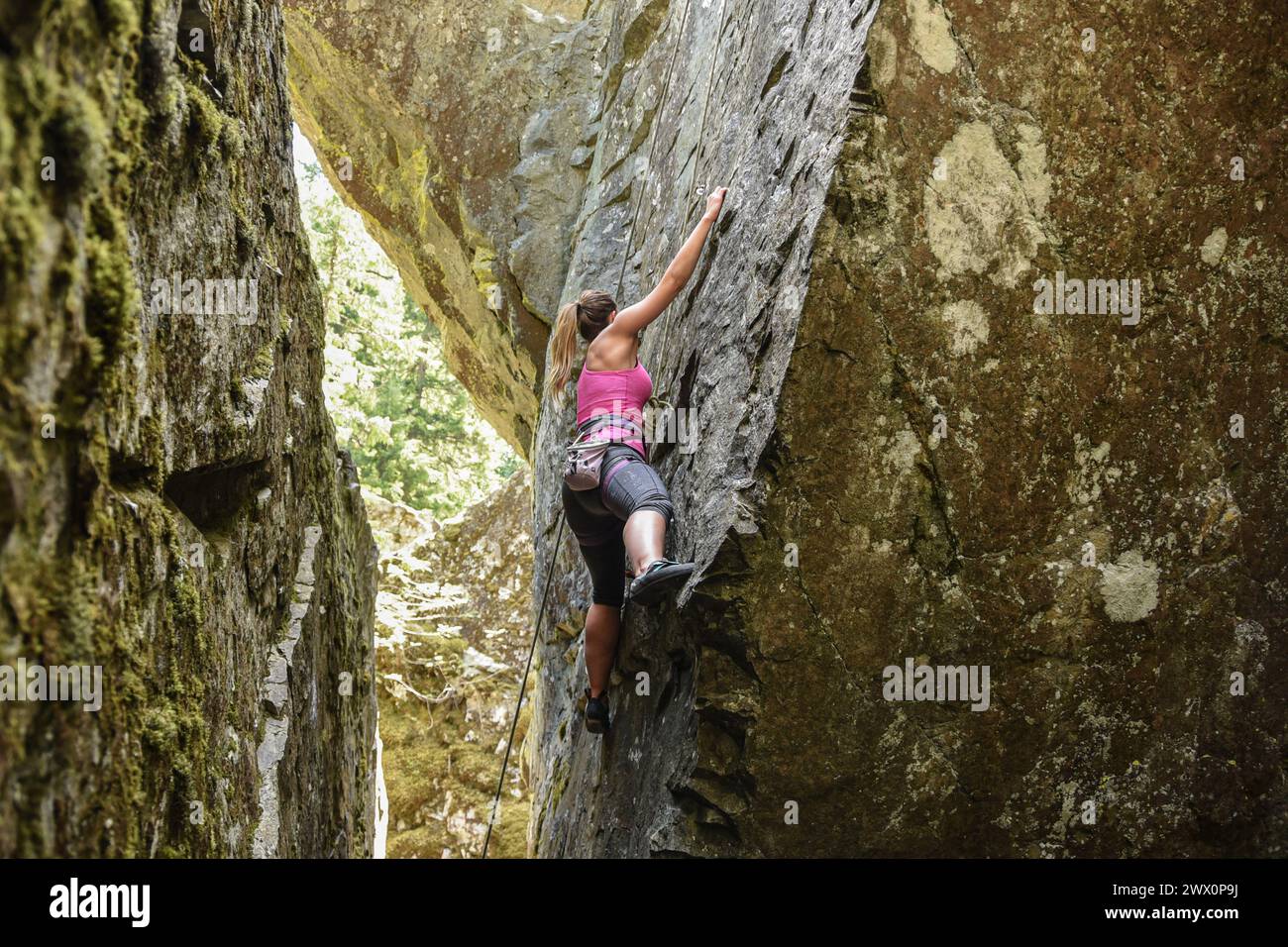 Woman climbing harness hi-res stock photography and images - Alamy