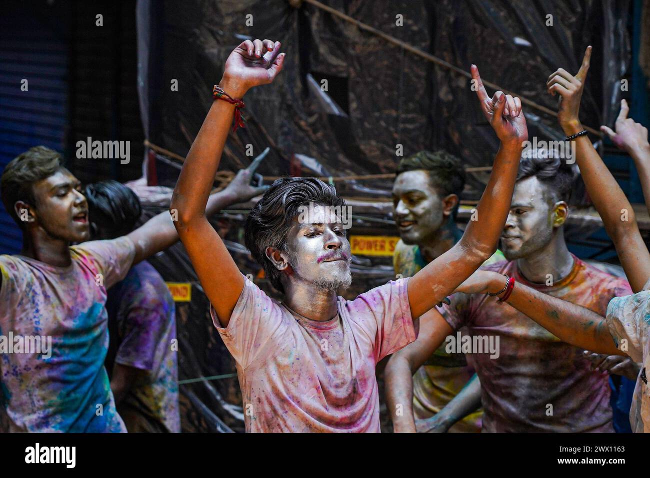Dhaka, Bangladesh . 26th Mar, 2024. March 26, 2024, Dhaka, Bangladesh: Young people with silver painted faces take to the streets to celebrate the Dol Purnima festival know as Holi Festival at Sakhari Bazar. on March 26, 2024 in Dhaka, Bangladesh. (Photo by Nahid Hasan/ Eyepix Group/Sipa USA) Credit: Sipa USA/Alamy Live News Stock Photo
