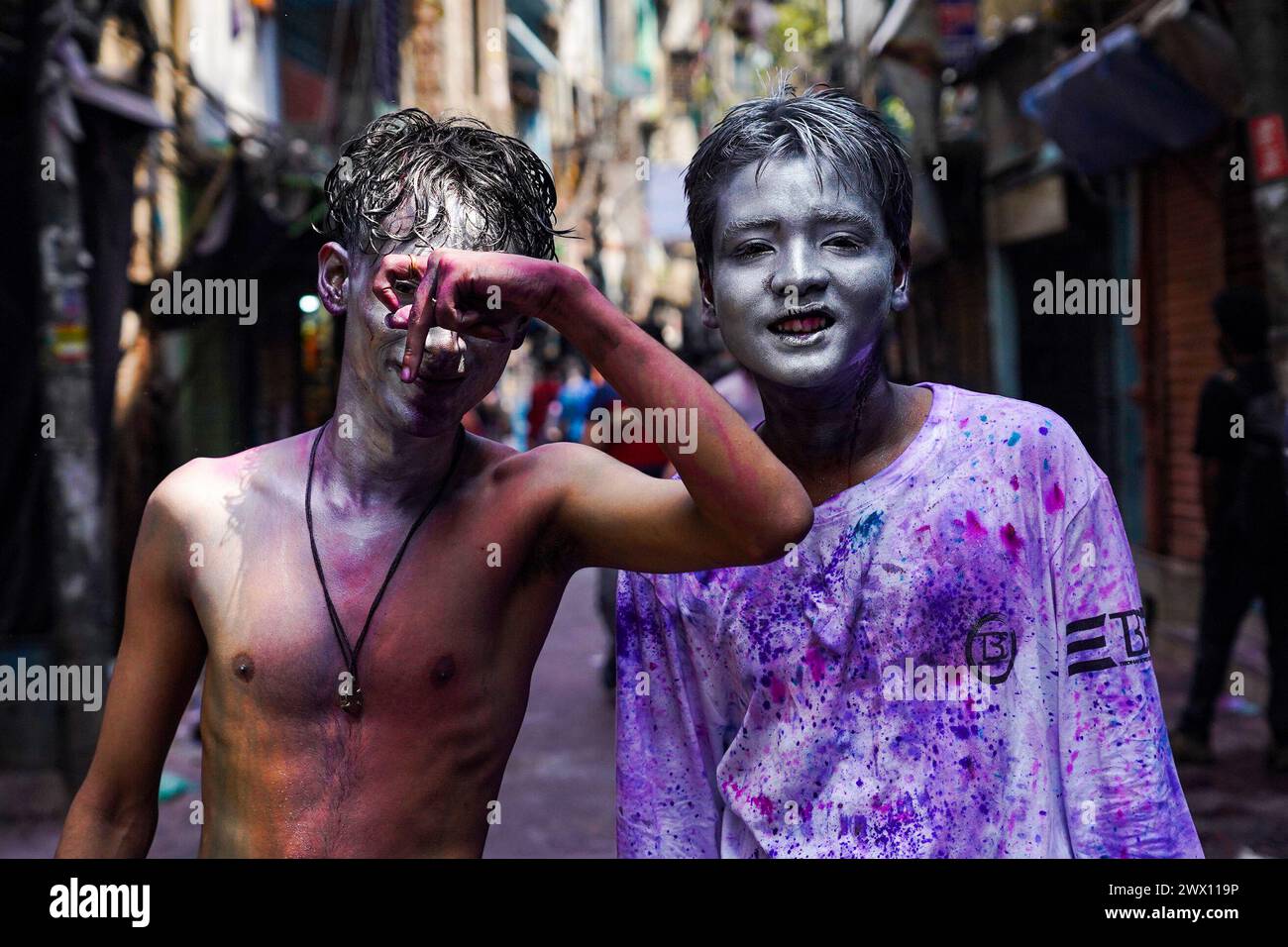 Dhaka, Bangladesh. 26th Mar, 2024. Young people with silver painted faces take to the streets to celebrate the Dol Purnima festival know as Holi Festival at Sakhari Bazar. on March 26, 2024 in Dhaka, Bangladesh. (Credit Image: © Nahid Hasan/eyepix via ZUMA Press Wire) EDITORIAL USAGE ONLY! Not for Commercial USAGE! Stock Photo