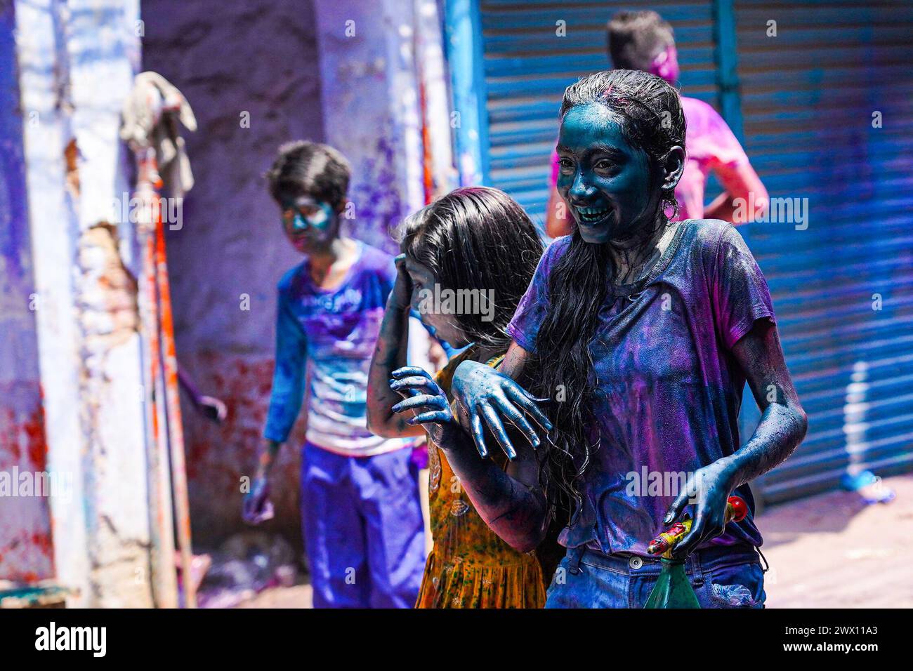 Dhaka, Bangladesh. 26th Mar, 2024. Young people with silver painted faces take to the streets to celebrate the Dol Purnima festival know as Holi Festival at Sakhari Bazar. on March 26, 2024 in Dhaka, Bangladesh. (Credit Image: © Nahid Hasan/eyepix via ZUMA Press Wire) EDITORIAL USAGE ONLY! Not for Commercial USAGE! Stock Photo