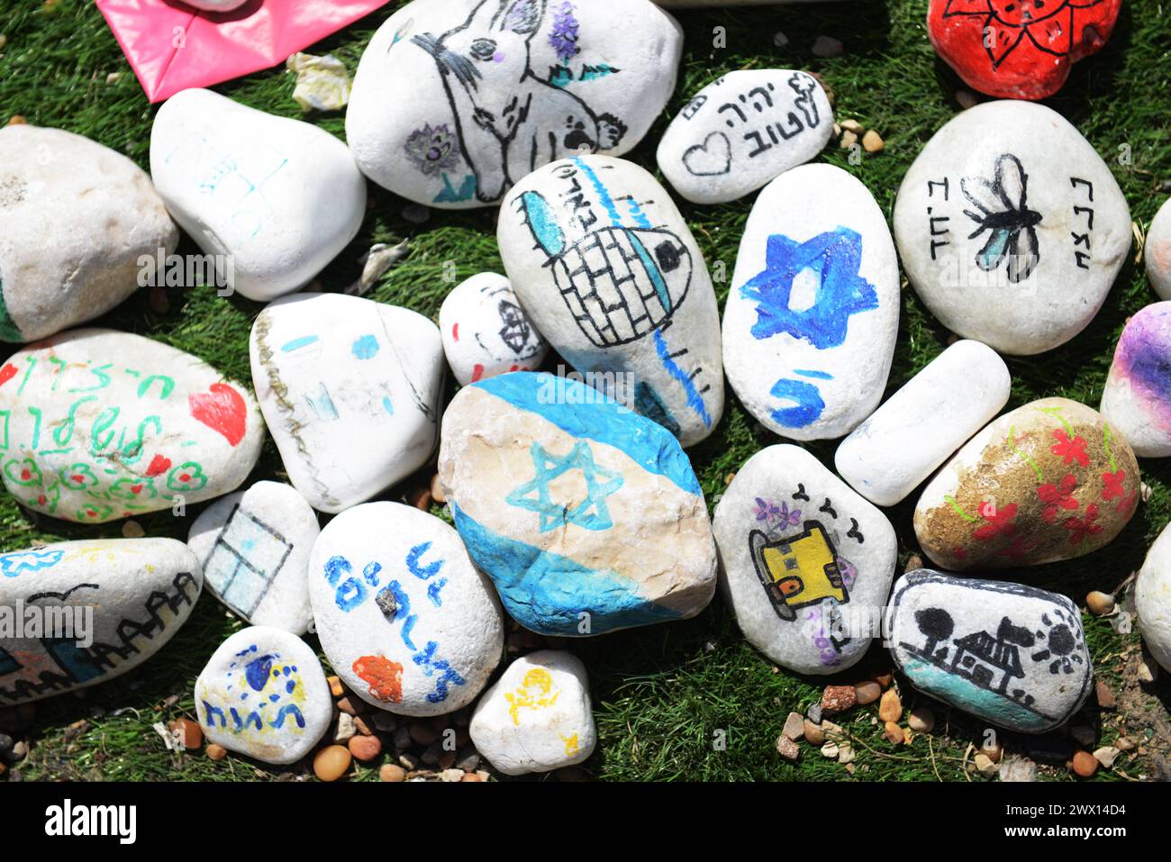 Stones with drawings and messages for the hostages in Gaza. Hostages Square, Tel-Aviv, Israel. Stock Photo