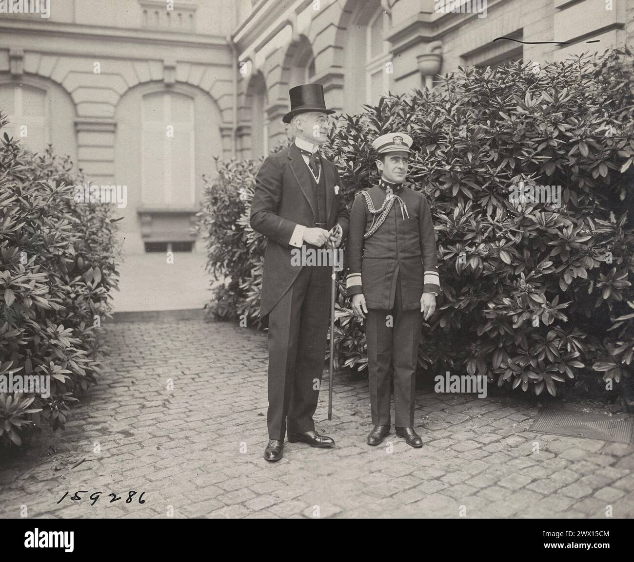 Mr. Bernard Baruch and Rear Admiral Cary T. Grayson, aide and medical advisor to President Wilson in front of the King's Palace. Brussels, Belgium ca. June 1919 Stock Photo