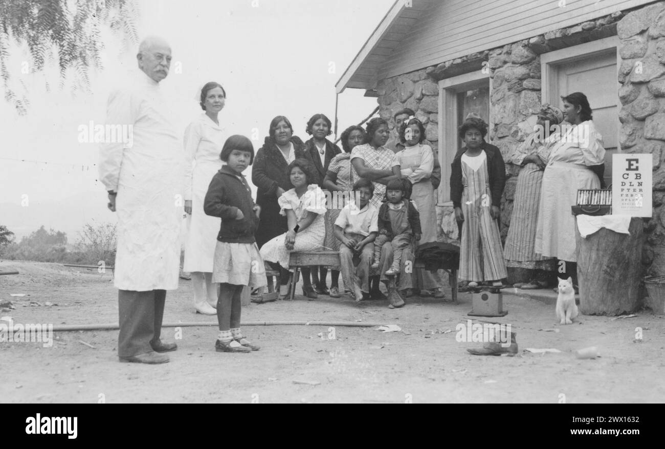 San Manuel Band of Mission Indians, California: Original caption: 'Eye examinations. Contract Physician Dr. Evans and Field Nurse Mabel Cowser at San Manuel Reservation' ca. 1936-1942 Stock Photo