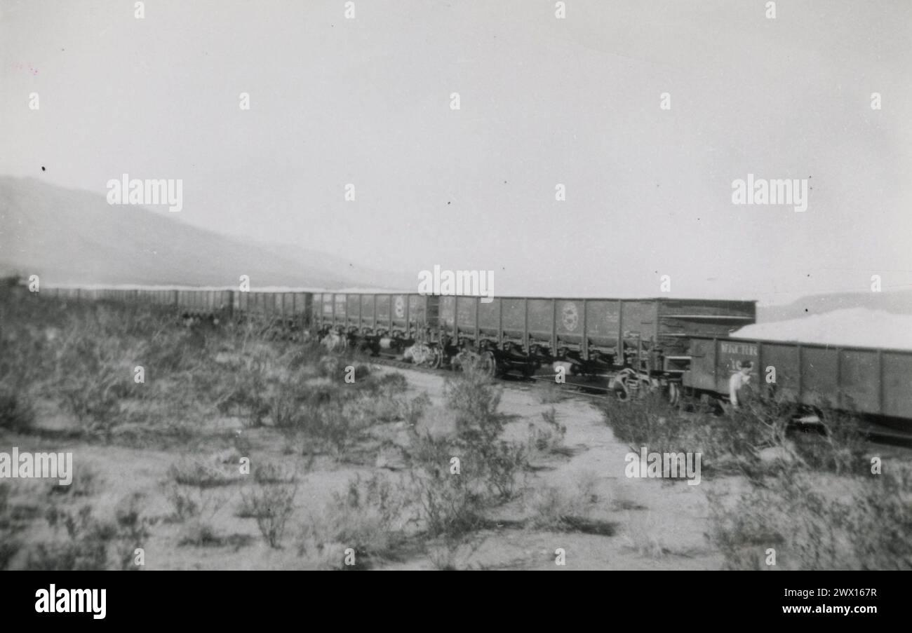 Rail cars filled with what is probably pumice at Sykes siding on land condemned for the building of Naval Air Weapons Station, China Lake in  Inyo County California ca. 1947 Stock Photo