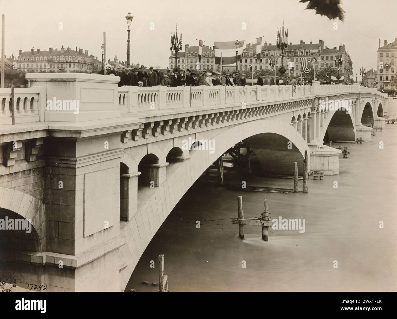 Crowds on top of Pont Wilson (bridge dedicated to Woodrow Wilson) celebrating Bastile Day in Lyon France ca. 1918 Stock Photo