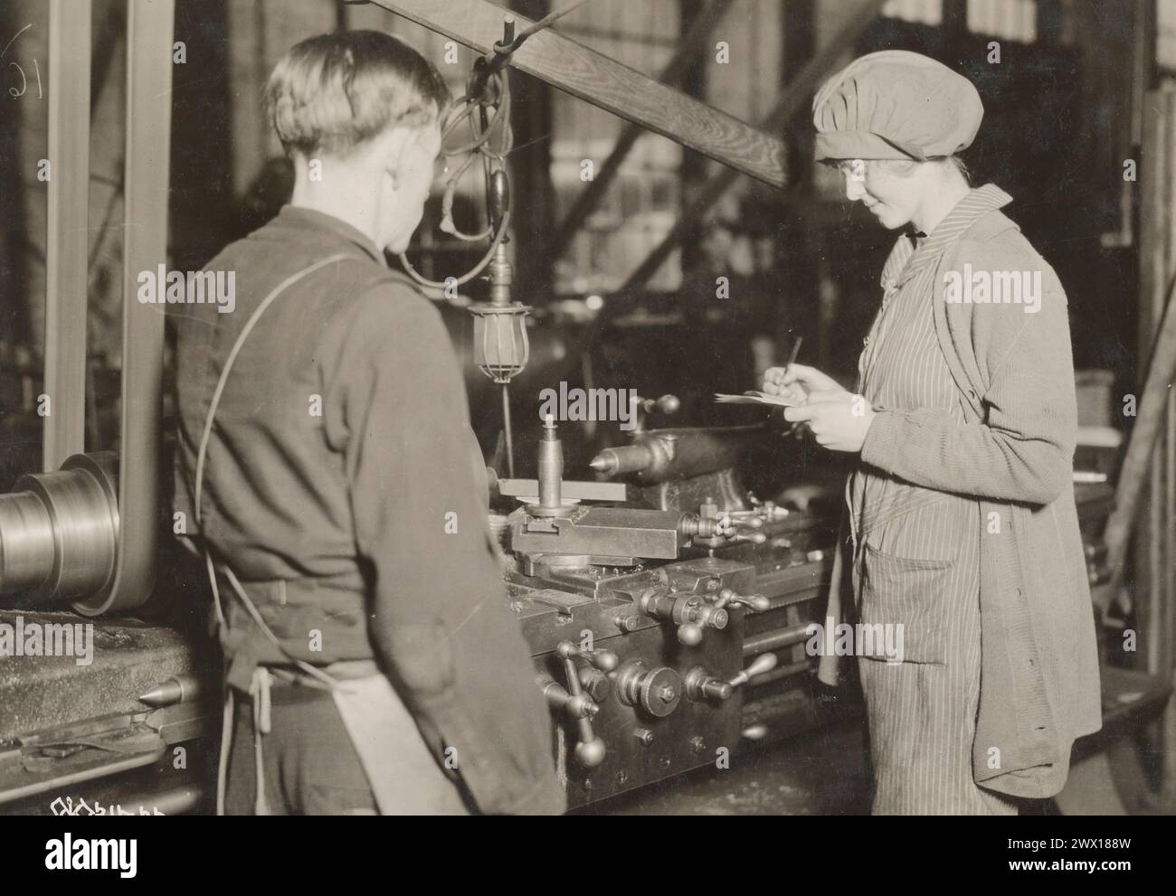 Women Workers WW I - A woman makes notes at Midvale Steel & Ordance Company ca. 1918 Stock Photo