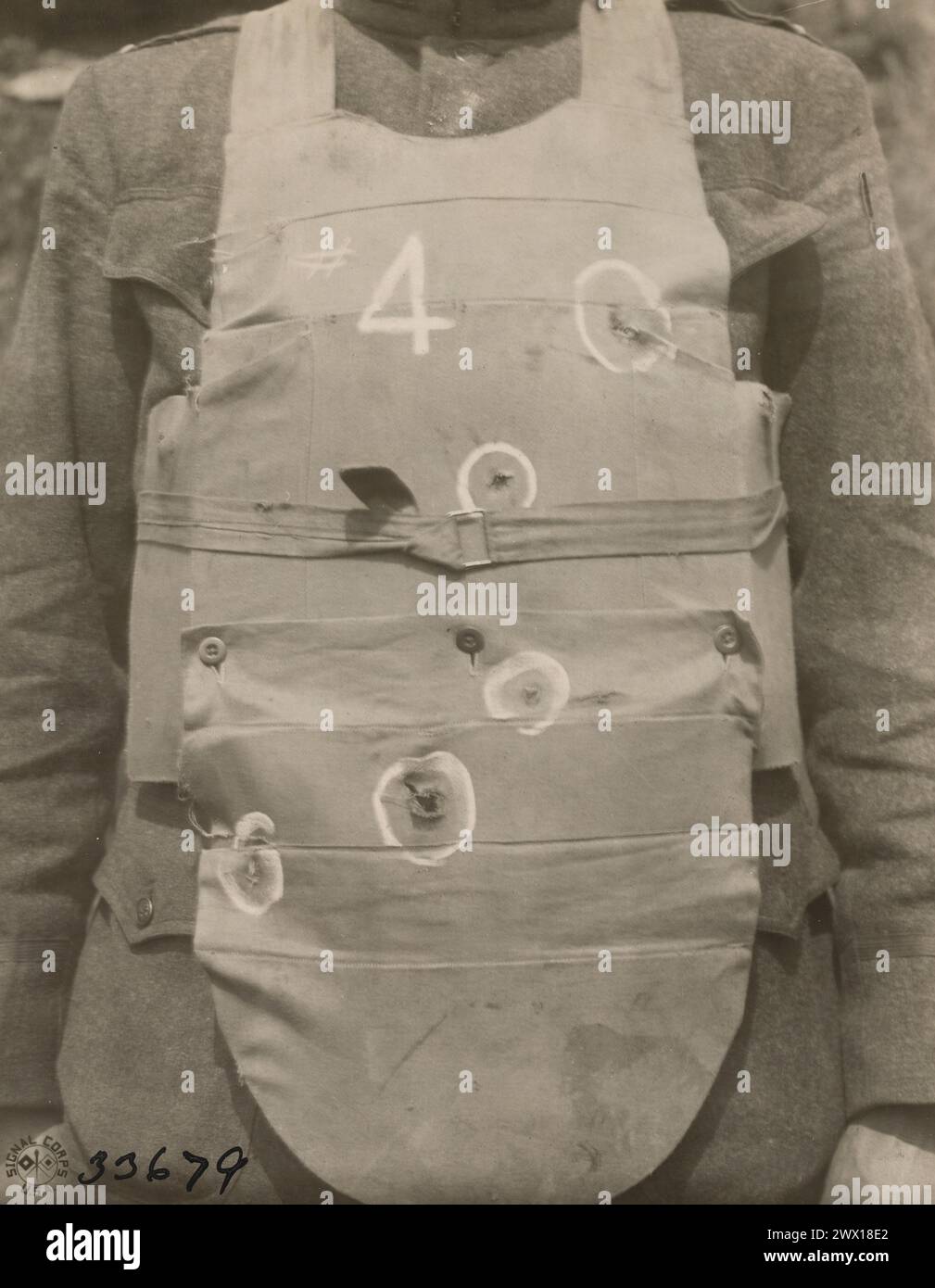 Result of a body armor test - Light weight 7 lbs 10 oz, .45 caliber pistol fired at 15 and 25 yards resulted in dents up to 1/4 inch, no penetration ca. 1918 Stock Photo