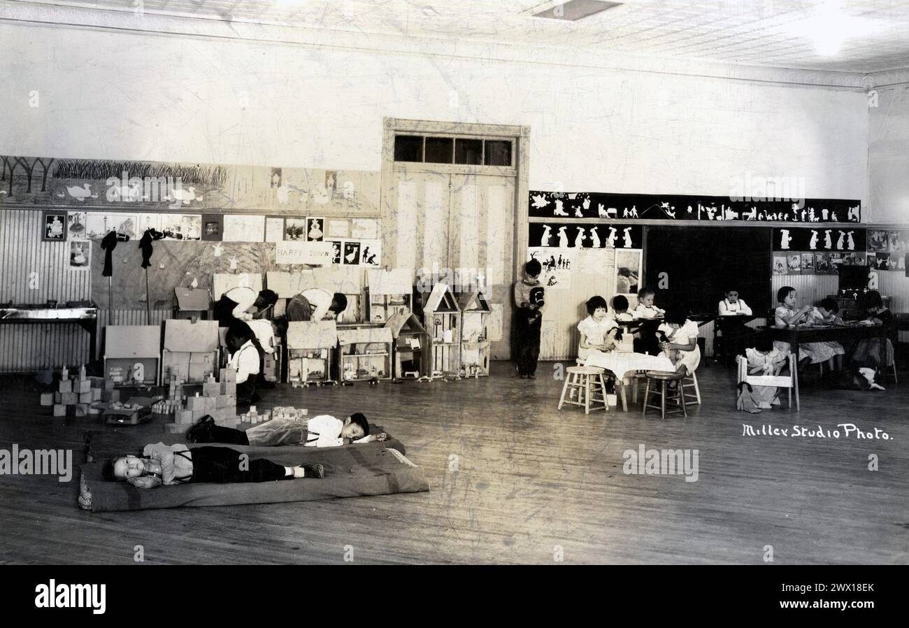 Small Children at Rest and Play in an Indian school on an unidentified South Dakota reservation ca. 1926-1956 Stock Photo