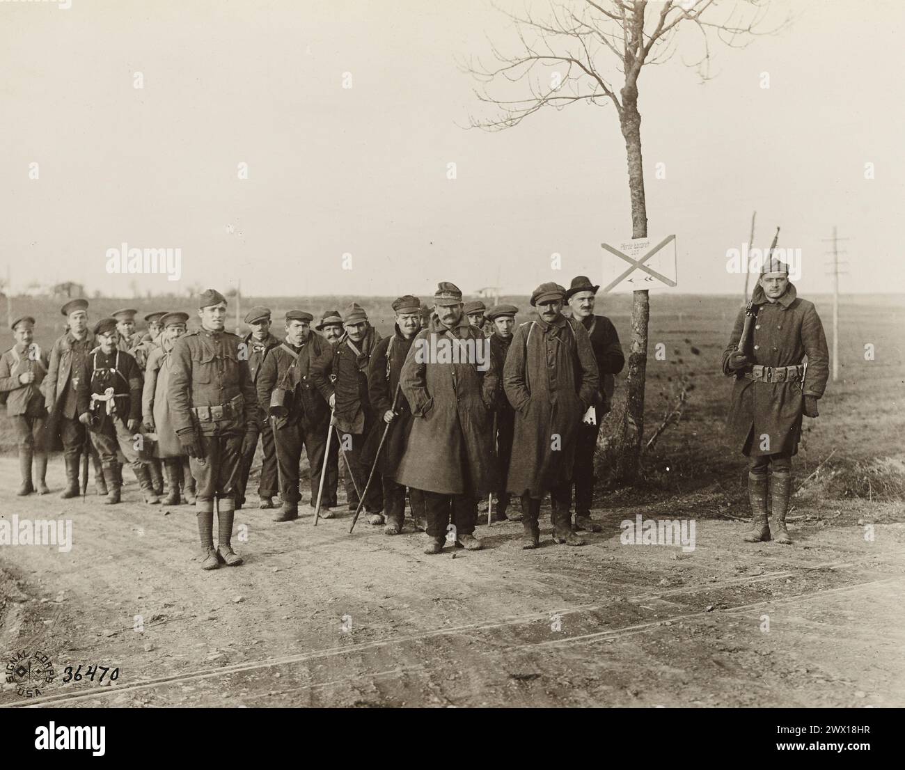 Russian and Italian prisoners of war being turned over to Americans at the front line. These men had been prisoners for two years ca. November 1918 Stock Photo
