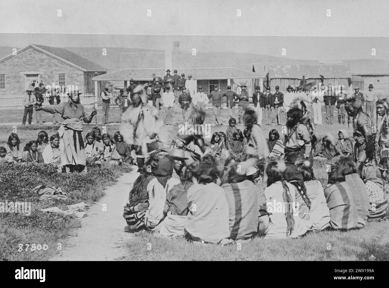 Shoshone Indians at Ft. Washakie, Wyoming Indian Reservation . . . Chief Washakie (At Left) Extends His Right Arm ca. 1892 Stock Photo