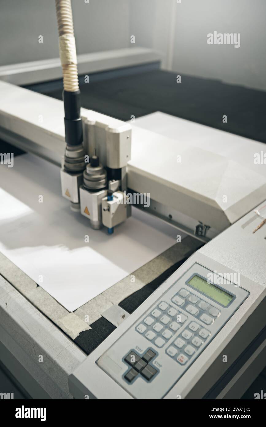 Printer, machine and paper laser at warehouse with manufacturing distribution, ink jet or press. Technology, automated and supplier tools for Stock Photo