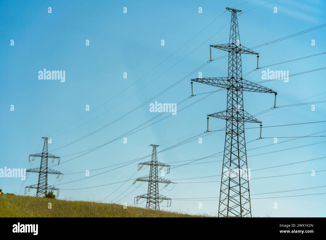 High voltage towers with sky background. Power line support with wires ...
