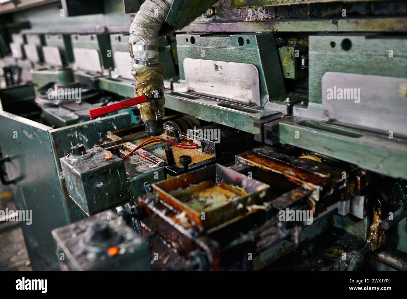 Closeup, printing and production with machine in factory for distribution, equipment and maintenance for safety. Warehouse, printer and press for Stock Photo