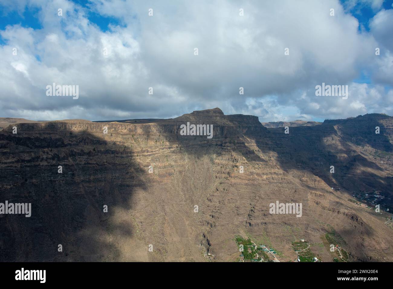 Mountains on the Canary Island of Gran Canaria in Spain, with blue sky and clouds Stock Photo