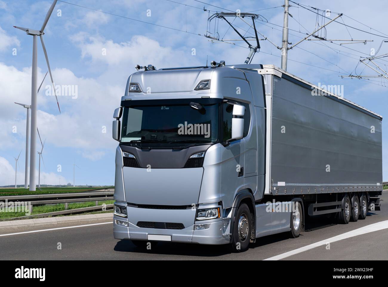 Electric semi truck with pantograph takes energy from wires above the ...