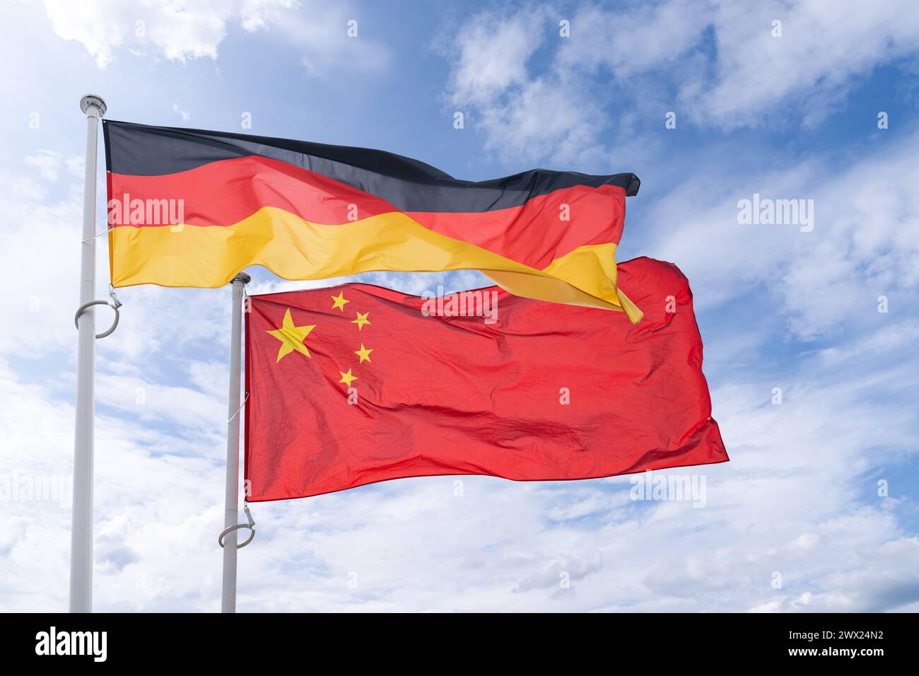 German and Chinese flags flutter in the wind Stock Photo - Alamy