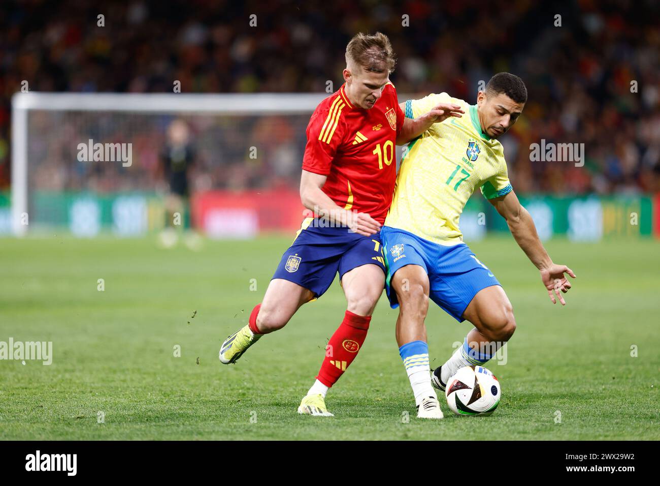 Madrid, Spain, March 26, 2024,  Andre Trindade da Costa Neto of Brazil and Dani Olmo of Spain during the International friendly football match between Spain and Brazil on March 26, 2024 at Santiago Bernabeu stadium in Madrid, Spain Stock Photo