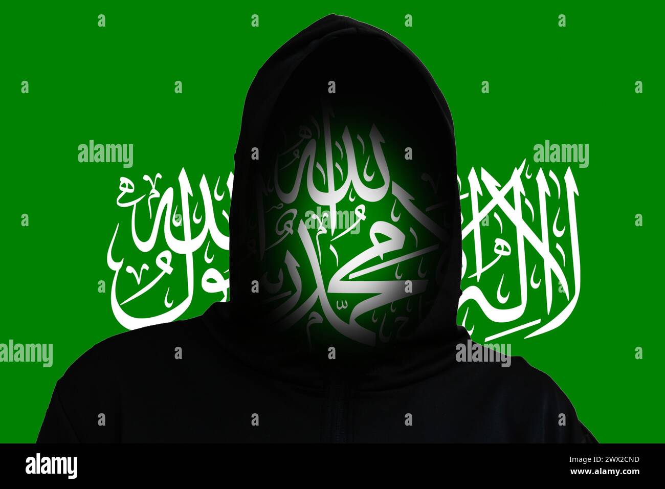 Incognito terrorist on the Flag Hamas background. Hamas between Israel and Palestine. Israel Palestine war. World crisis in Middle East. Rebellion. Re Stock Photo