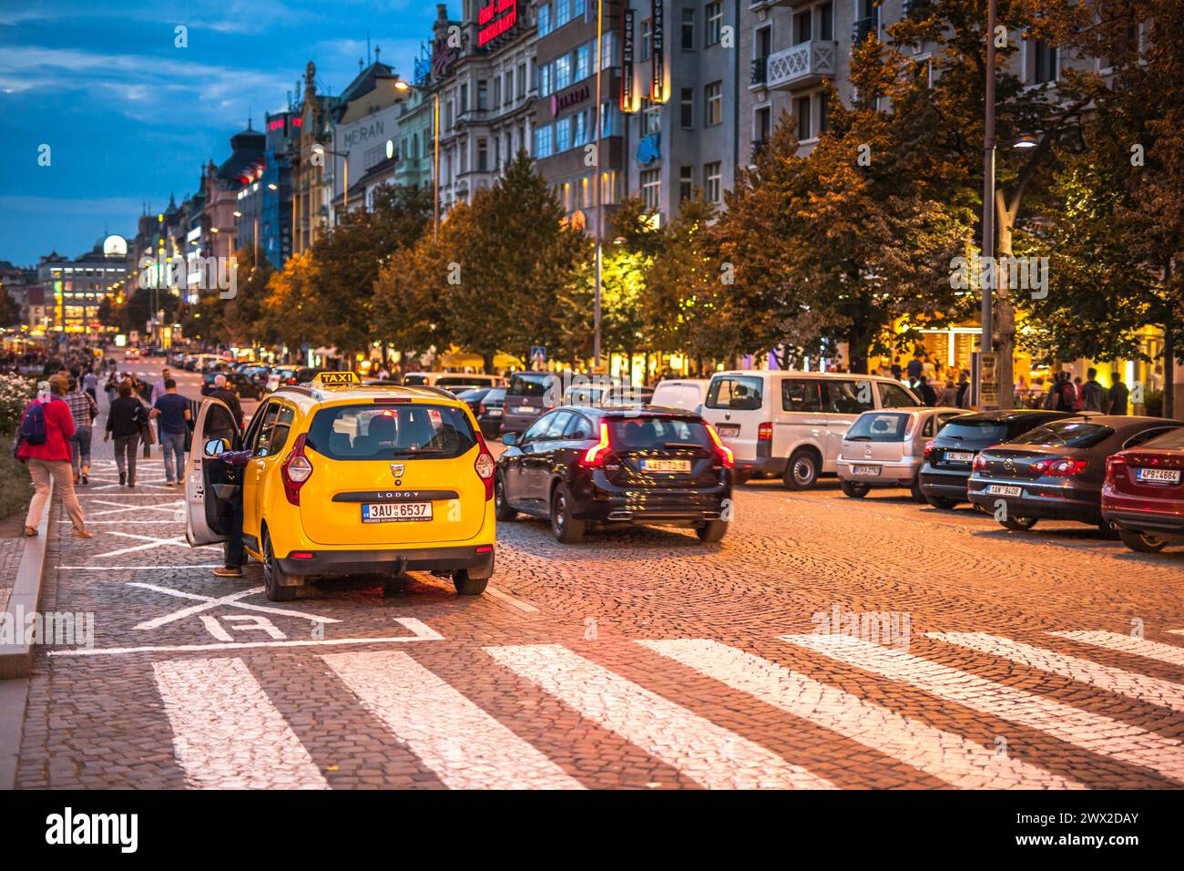 Bustling Evening Traffic and Pedestrians at Wenceslas Square, Prague Stock Photo