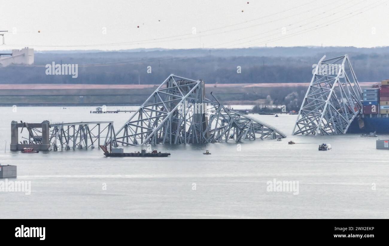 Steel debris from the fallen Francis Scott Key Bridge blocks the ...