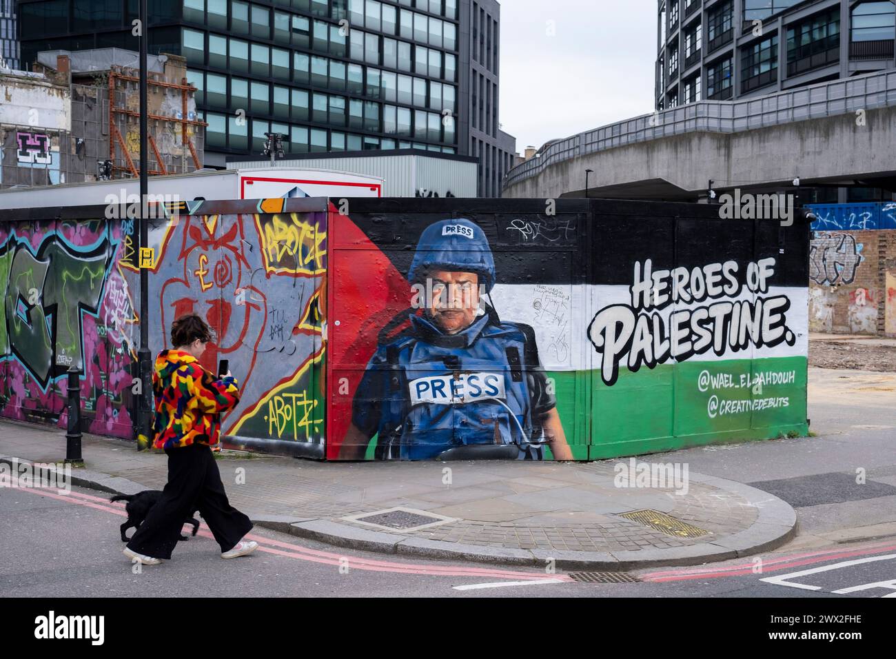 Heroes of Palestine mural in Shoreditch showing Palestinian journalist Wael El Dahdouh a member of the press wearing a flak jacket and helmet while covering the Israel- hammas war by Creative Debuts on 4th March 2024 in London, United Kingdom. Creative Debuts is an art organisation offering opportunities to emerging artists. Stock Photo