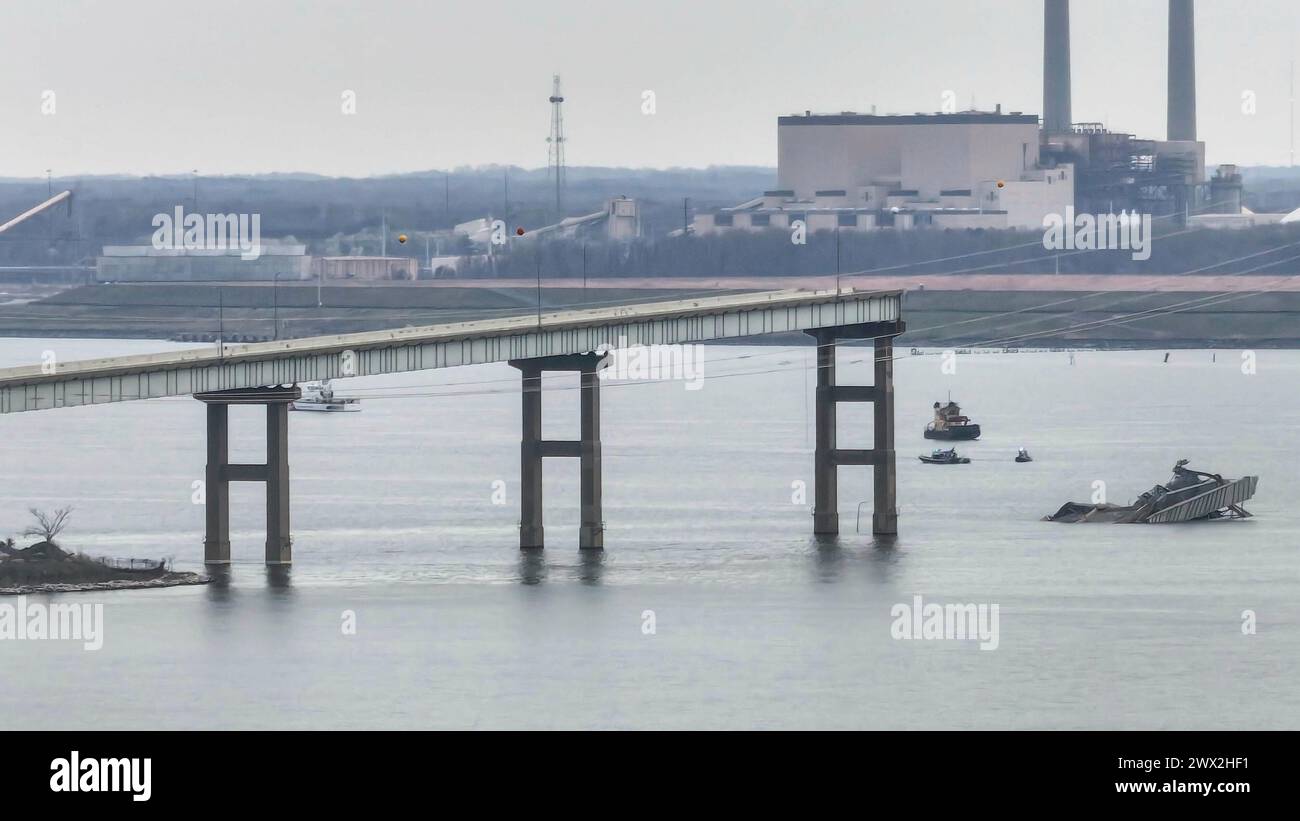 Part of the Francis Scott Key Bridge, remains standing in the aftermath ...