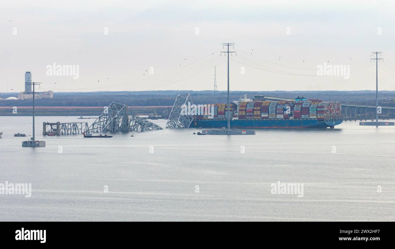 Steel debris from the fallen Francis Scott Key Bridge blocks the ...