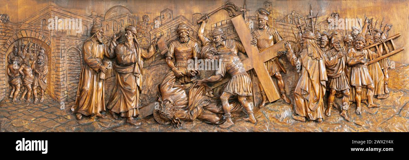 MILAN, ITALY - MARCH 5, 2024: The carved relief of Fall of Jesus under the cross in the church Chiesa di San Camillo by Annibale Pagnoni (1900). Stock Photo