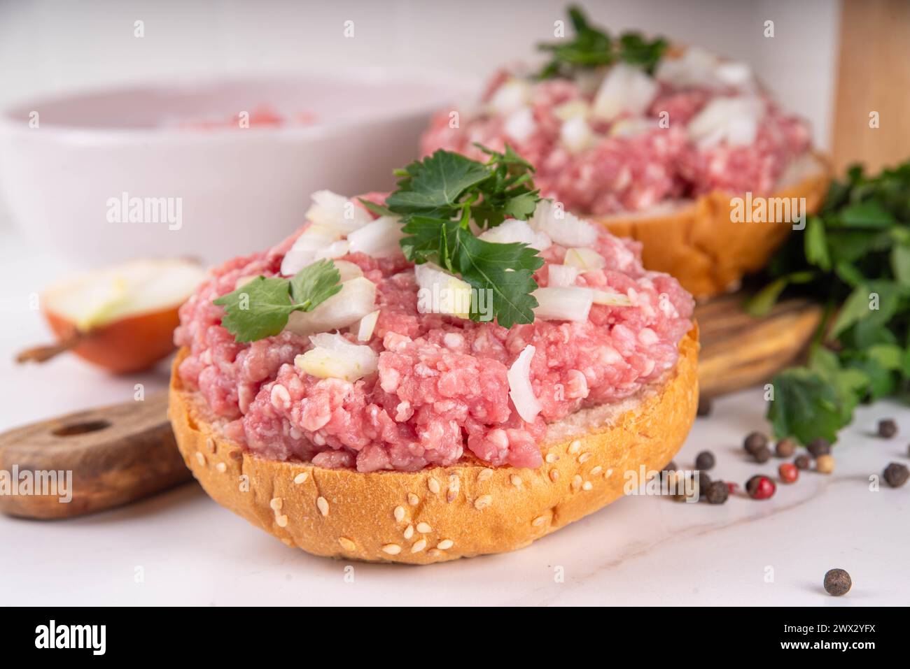 Mett brotchen, Brotzeit,  German traditional raw burger sandwich with minced pork, spices, onions, herbs Stock Photo