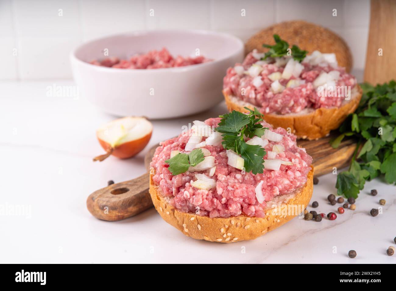 Mett brotchen, Brotzeit,  German traditional raw burger sandwich with minced pork, spices, onions, herbs Stock Photo