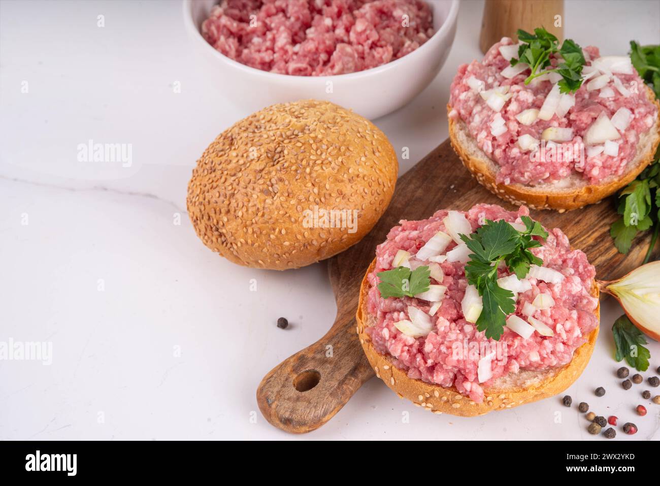 Mett brotchen, Brotzeit,  German traditional raw burger sandwich with minced pork, spices, onions, herbs Stock Photo