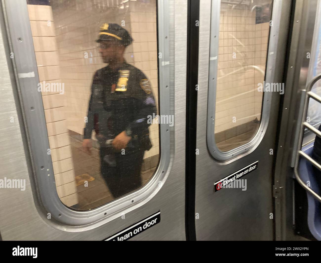 NYPD officer on the Jay Street Borough Hall station in Brooklyn in New NYPD officer on the Jay Street Borough Hall station in Brooklyn in New