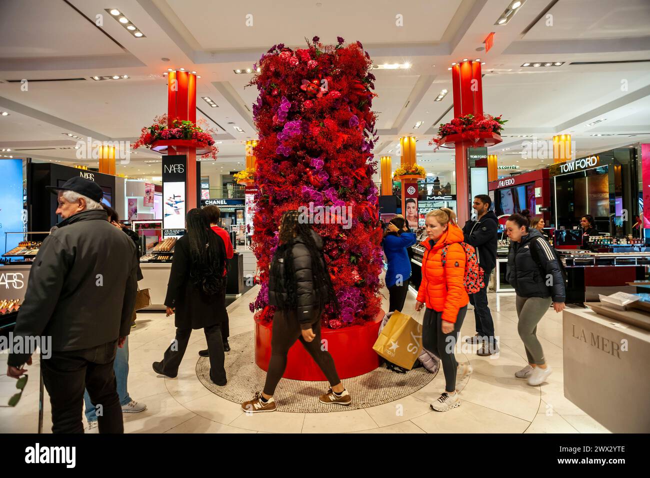 Visitors descend on Macy's flagship department store in Herald Square in New York festooned with floral arrangements for the 2024 49th annual Macy's Flower Show, in partnership with Dior, on opening day Sunday, March 24, 2024. The show will run until April 7th.  (© Richard B. Levine) Stock Photo