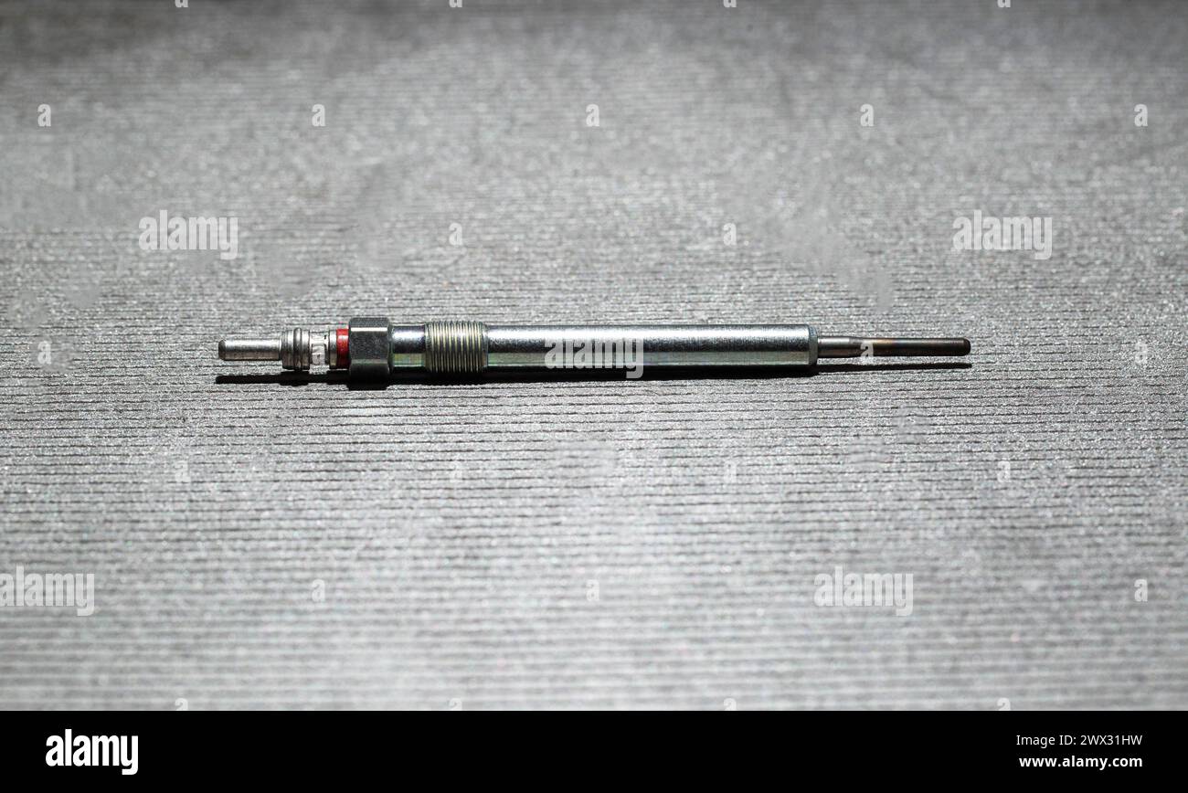 Glow plug for diesel engine combustion chamber. Facilitation of engine starting, pre-heating. Stock Photo